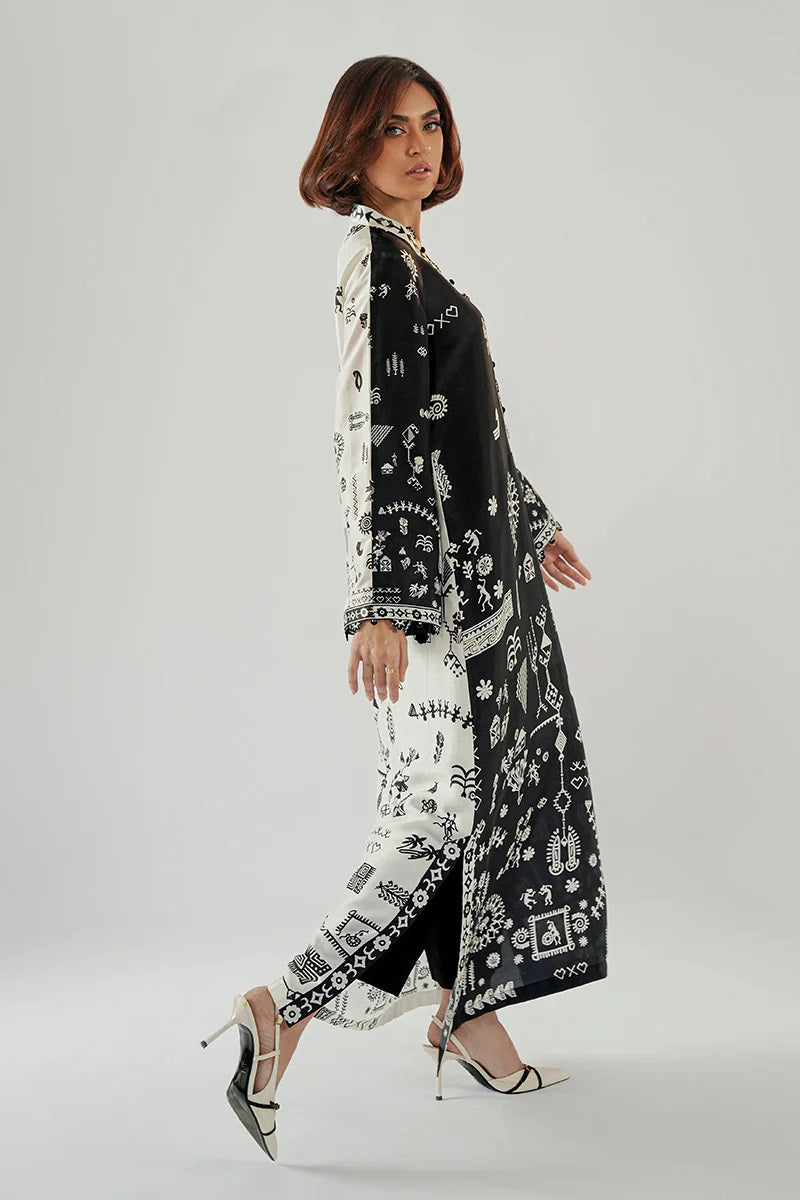 Contemporary Long Shirt-dress in a striking Black-And-White Split Design, Featuring Intricate, Tribal-Inspired White Motifs Printed Throughout