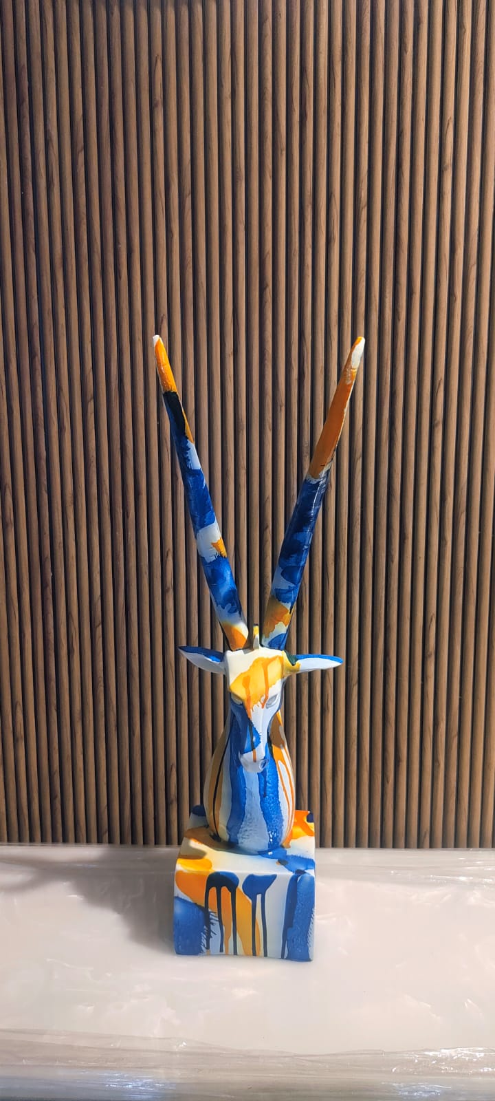 Vibrant And Artistic Antelope Head Sculpture Featuring Long Horns