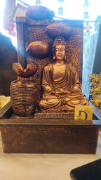 A Beautifully Designed Buddha Water Fountain Featuring A Meditating Buddha With Cascading Water Bowls