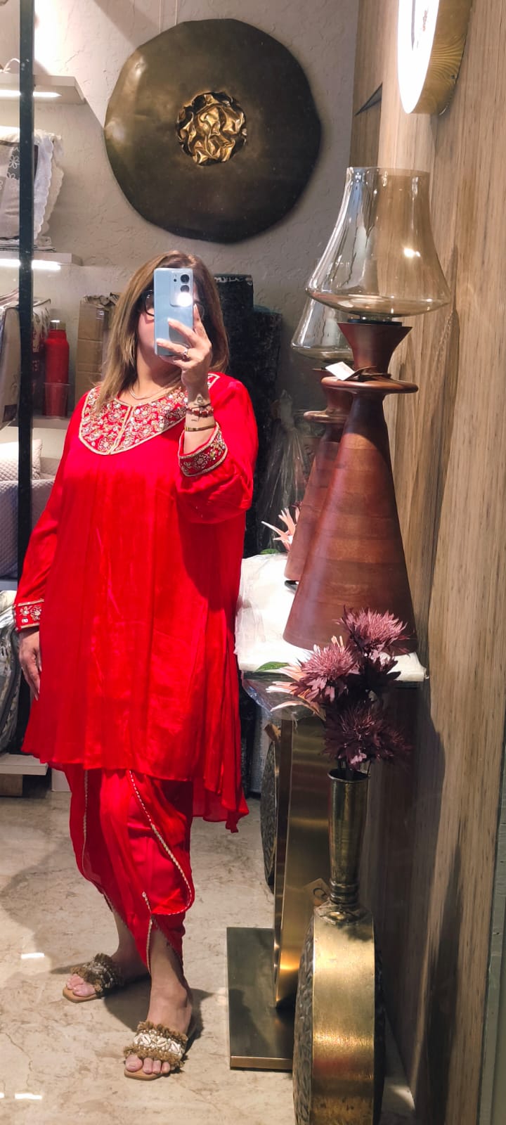 A Stunning Red Ethnic Outfit Featuring A Straight Kurta With Intricate Golden Embroidery