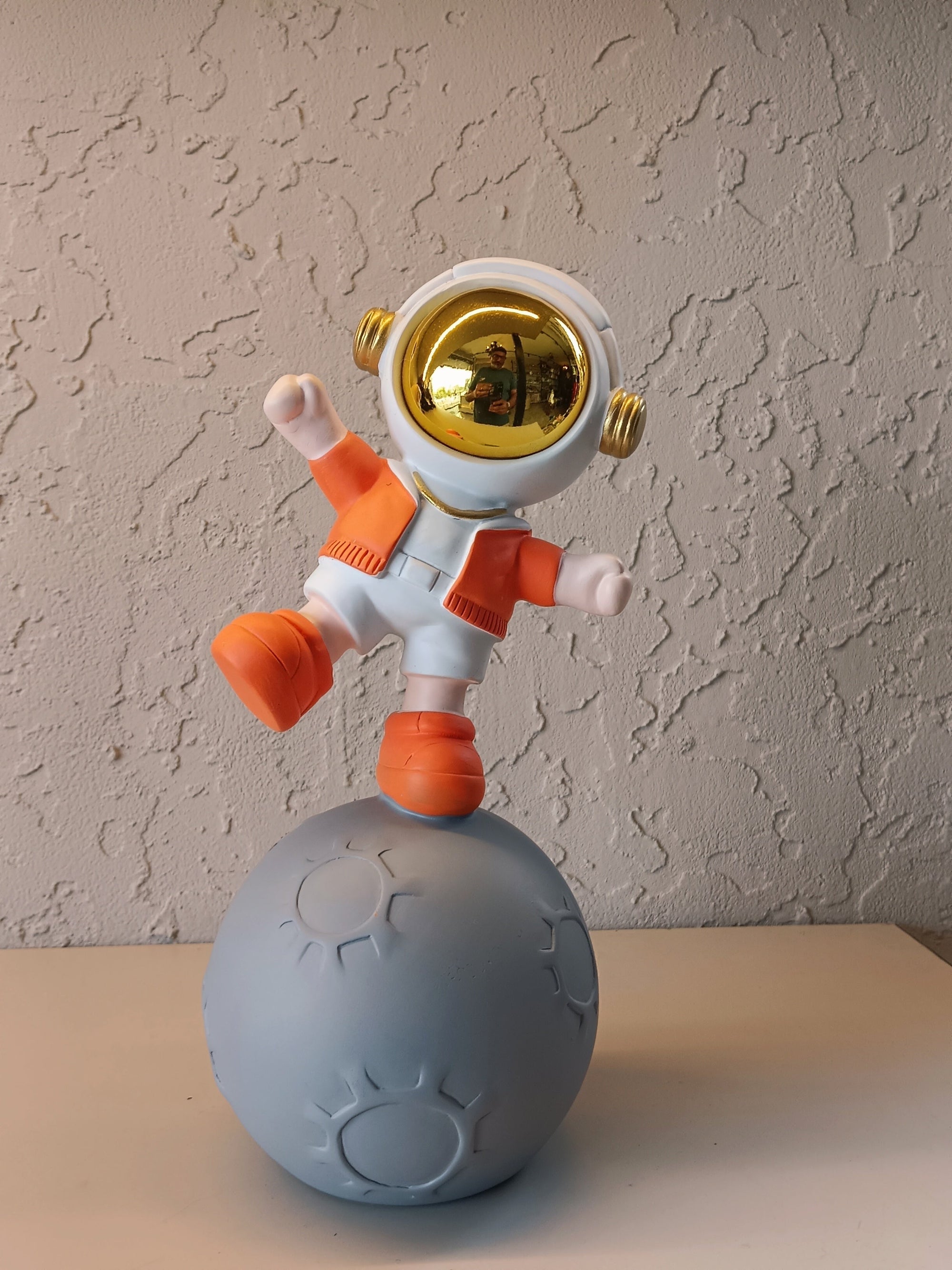 Playful Astronaut Standing On Styling Moon