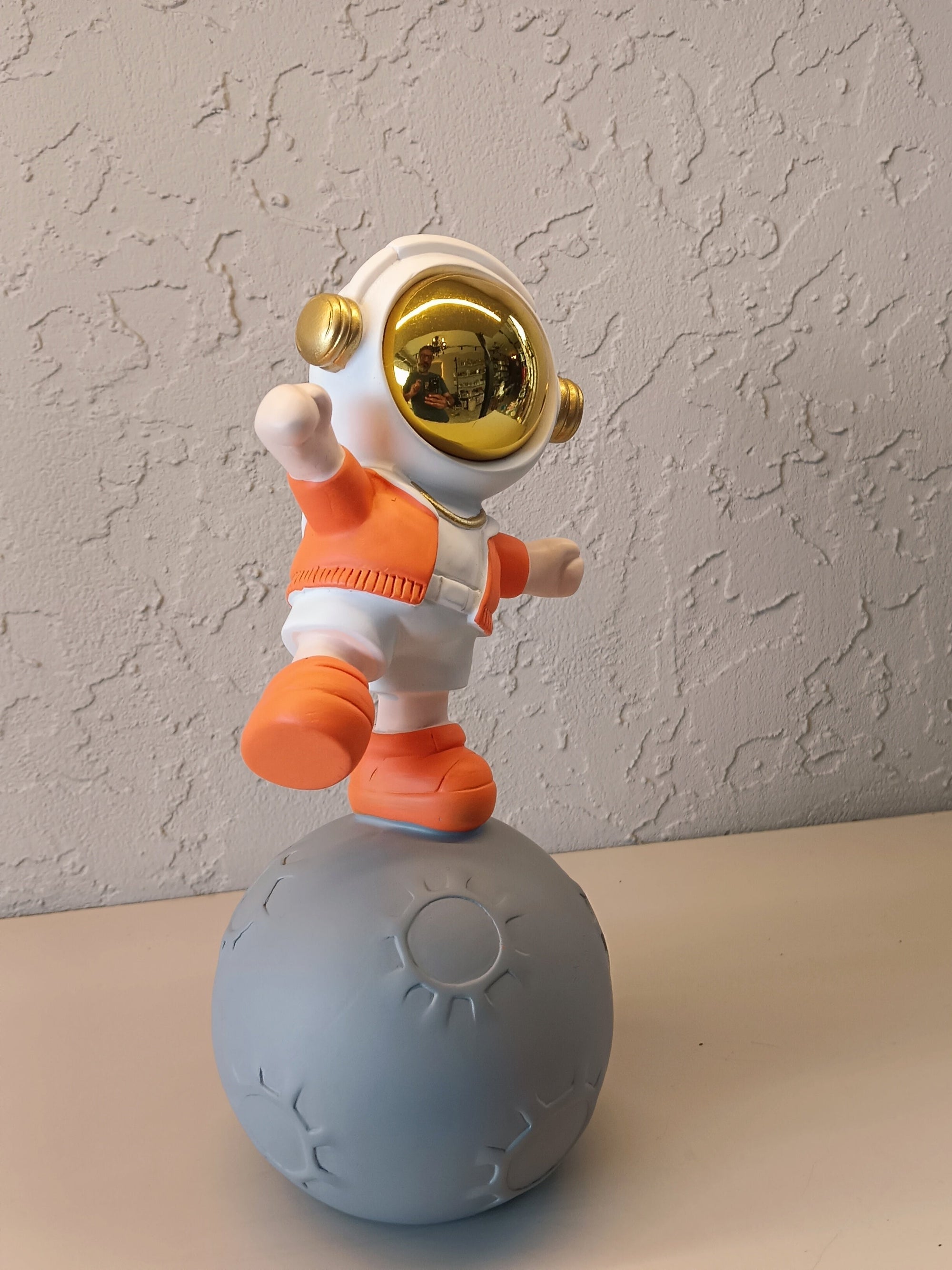 Playful Astronaut Standing On Styling Moon