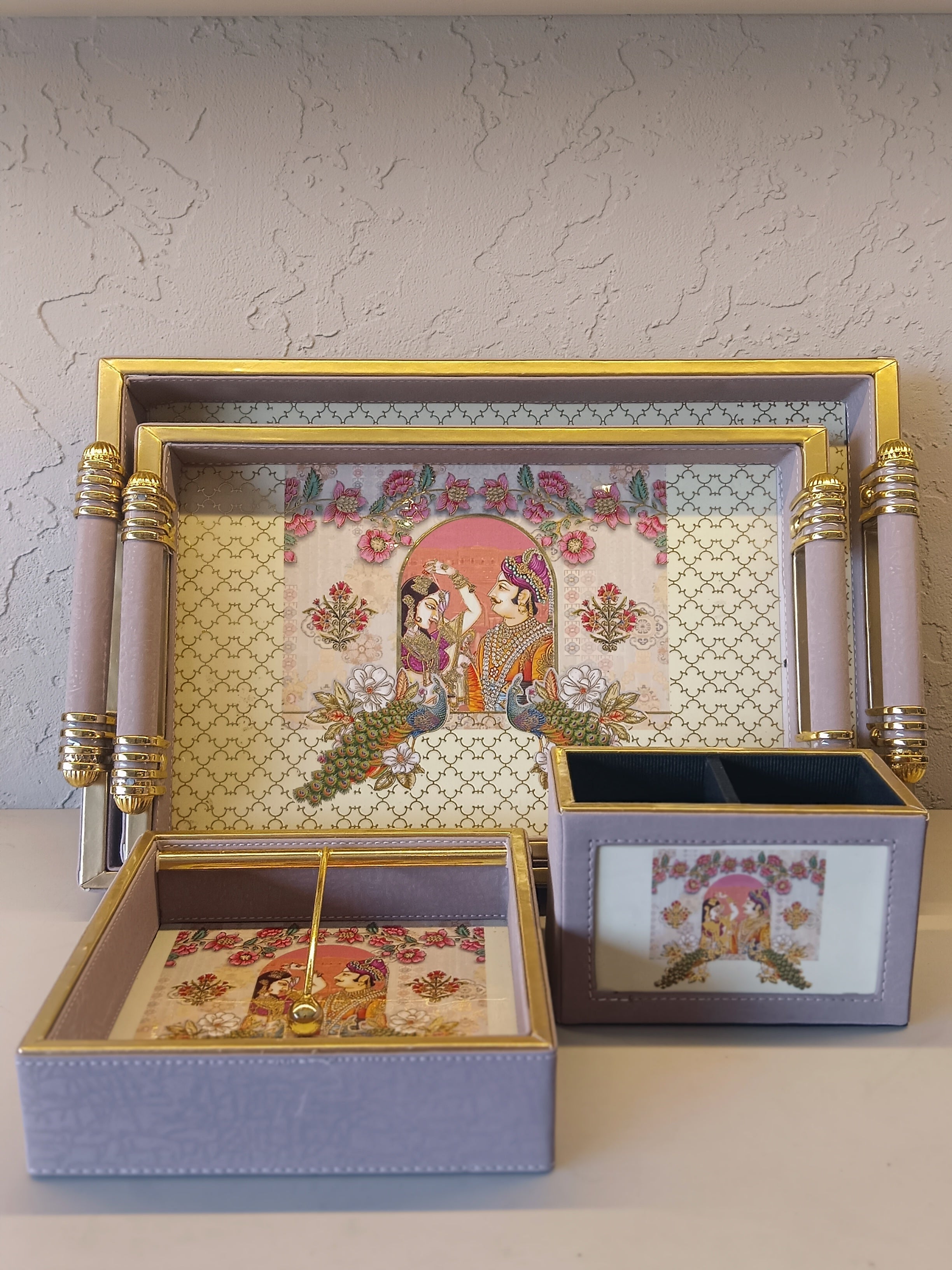 An Elegant Desk Accessory Set, Featuring A Tray, Box, And Tissue Holder, All Adorned With A Pastel Lavender Finish
