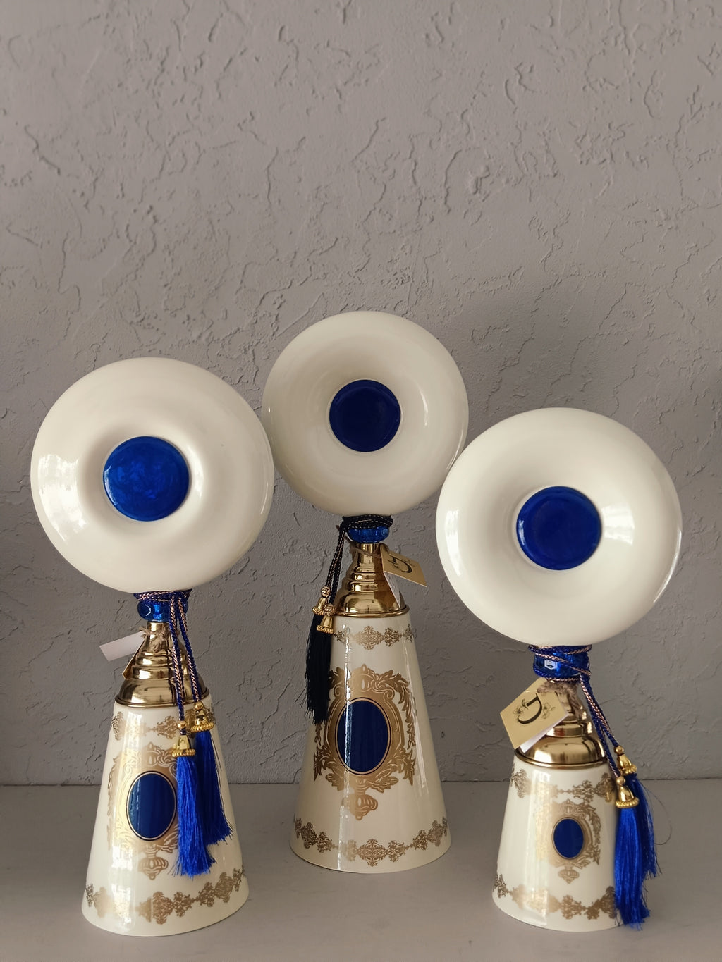 Turkish-Style Metal Decor Pieces,Featuring Conical Bases Adorned With Intricate Gold Detailing