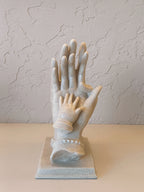 Sculpture With Child,s Hand Resting,Symbolizing love