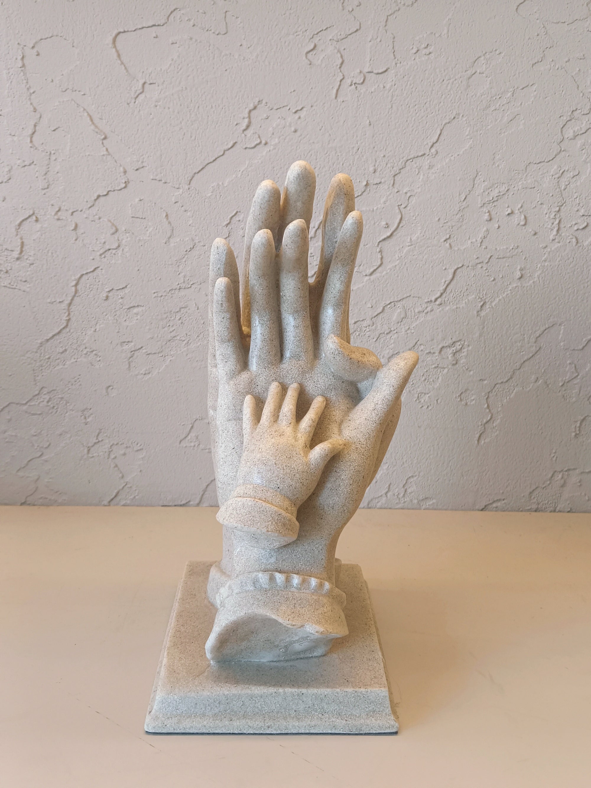 Sculpture With Child,s Hand Resting,Symbolizing love