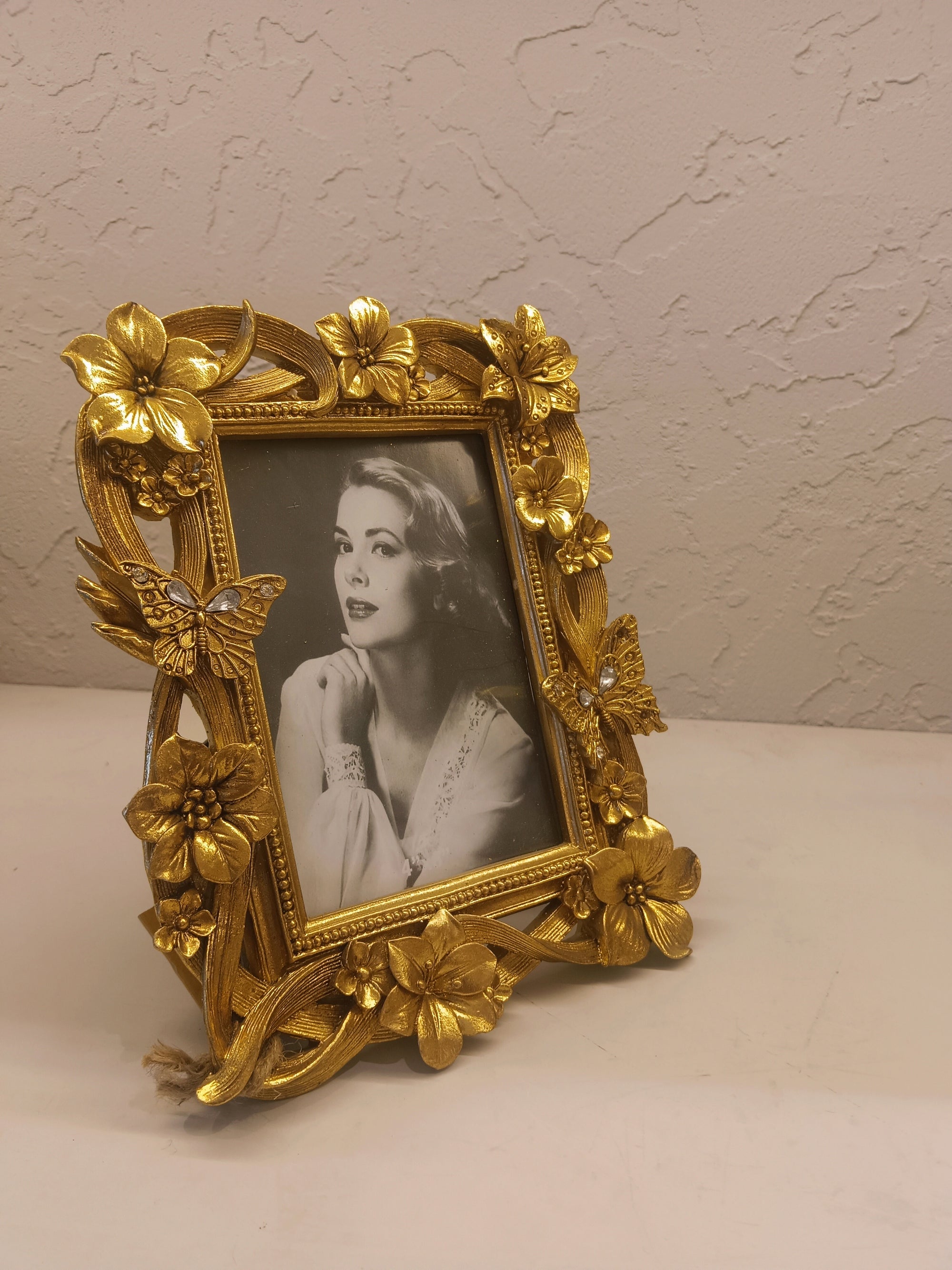 Ornate Golden Photo frame Adorned With Intricately Sculpted Flowers And Butterflies