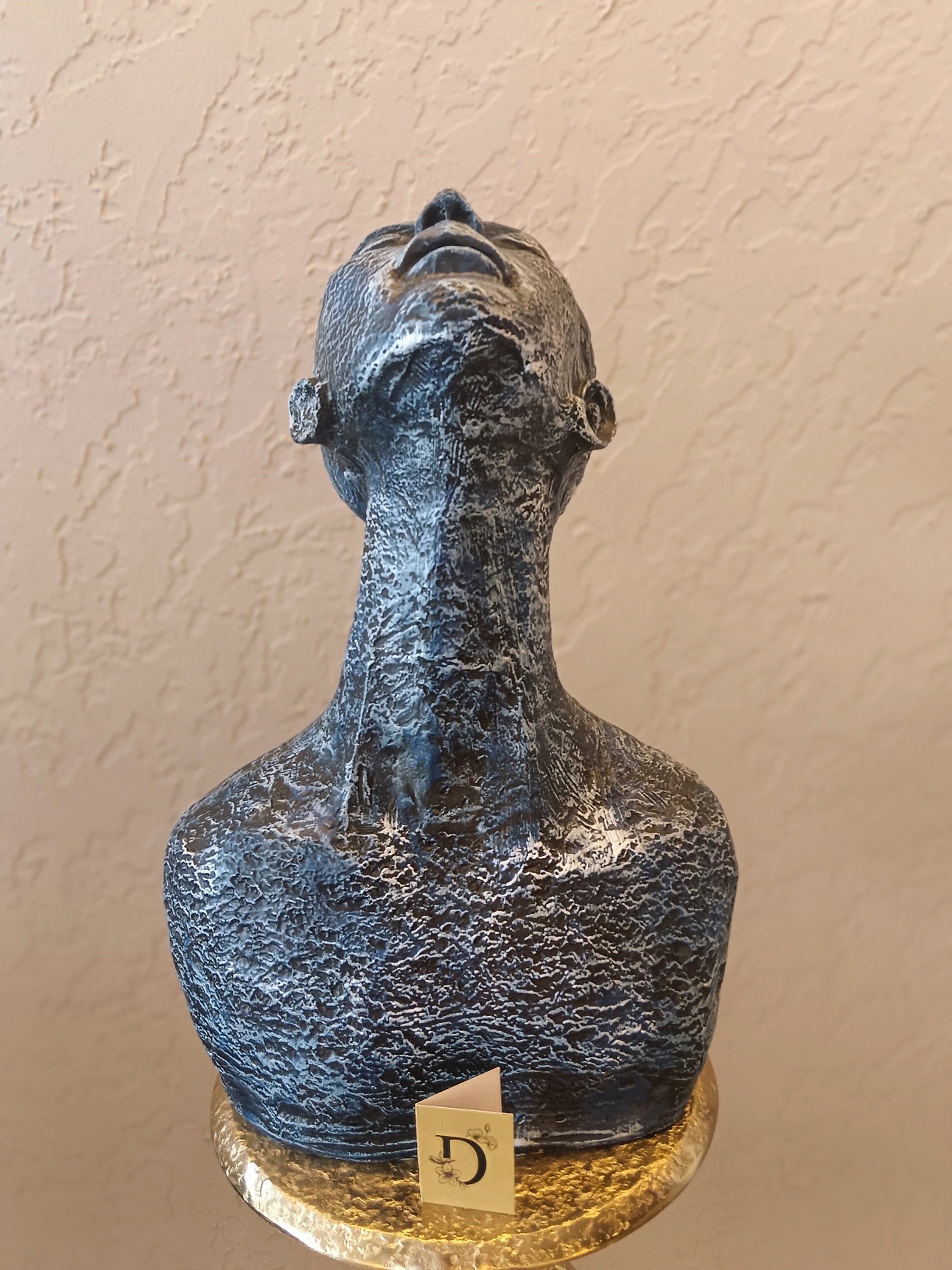 A Modern Sculpture Of Human Bust With The Head Tilted Upward
