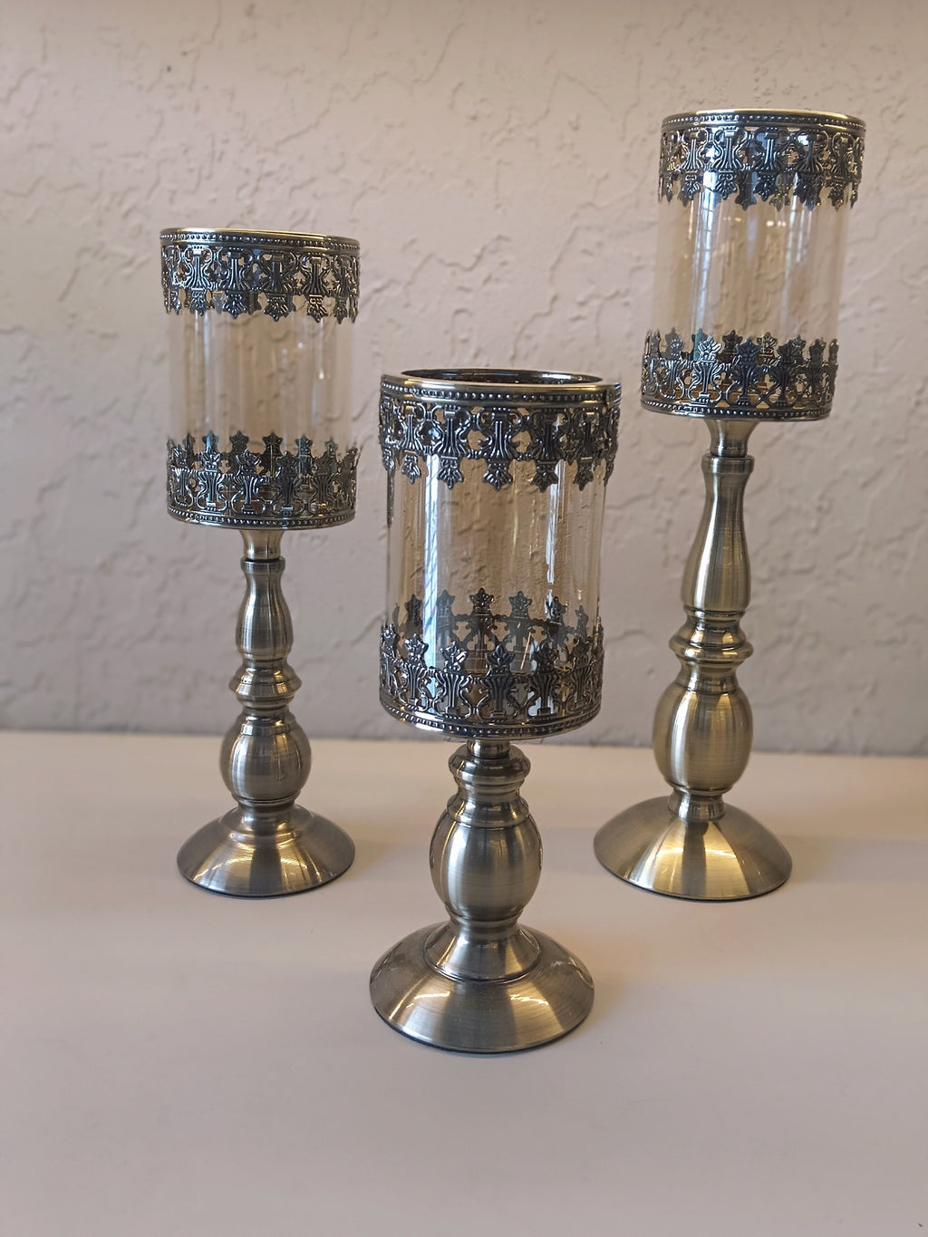 Candle Holders Crafted With Metallic Accents  And Glass