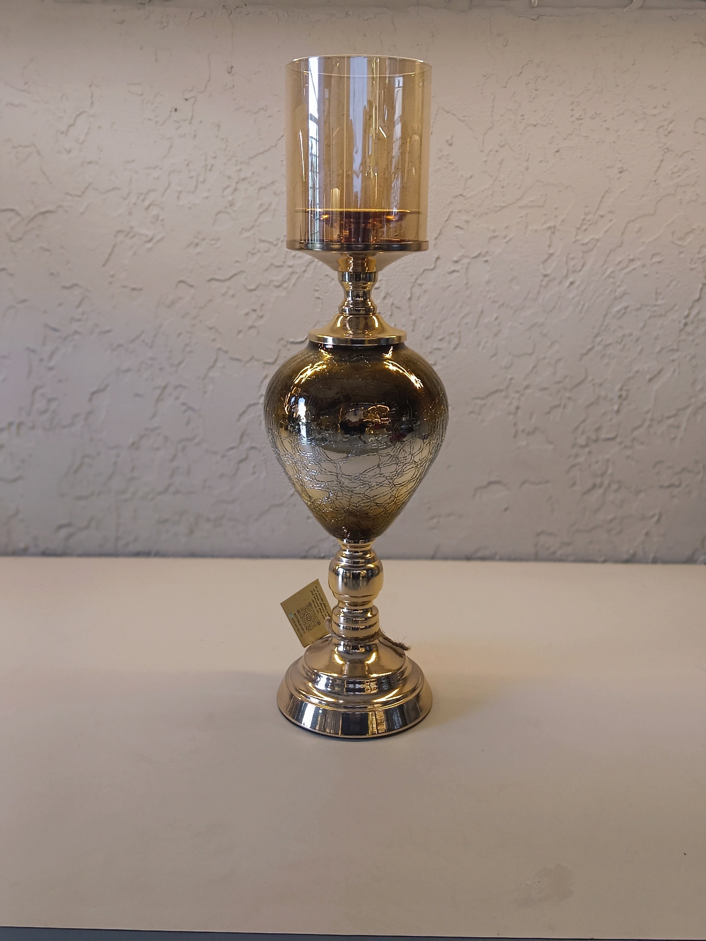 Candle Holders With A Reflective Silver Finish And Amber -Tinted Glass