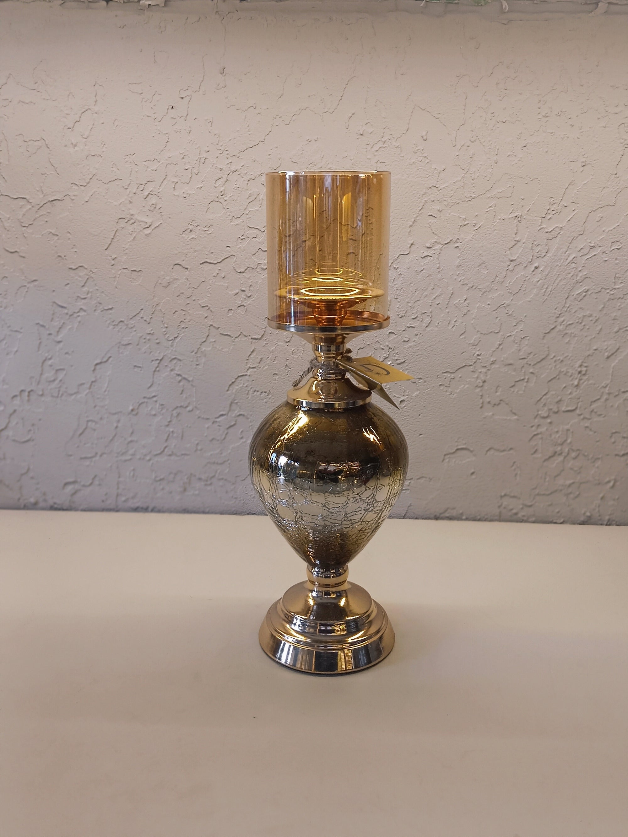 Candle Holders With A Reflective Silver Finish And Amber -Tinted Glass