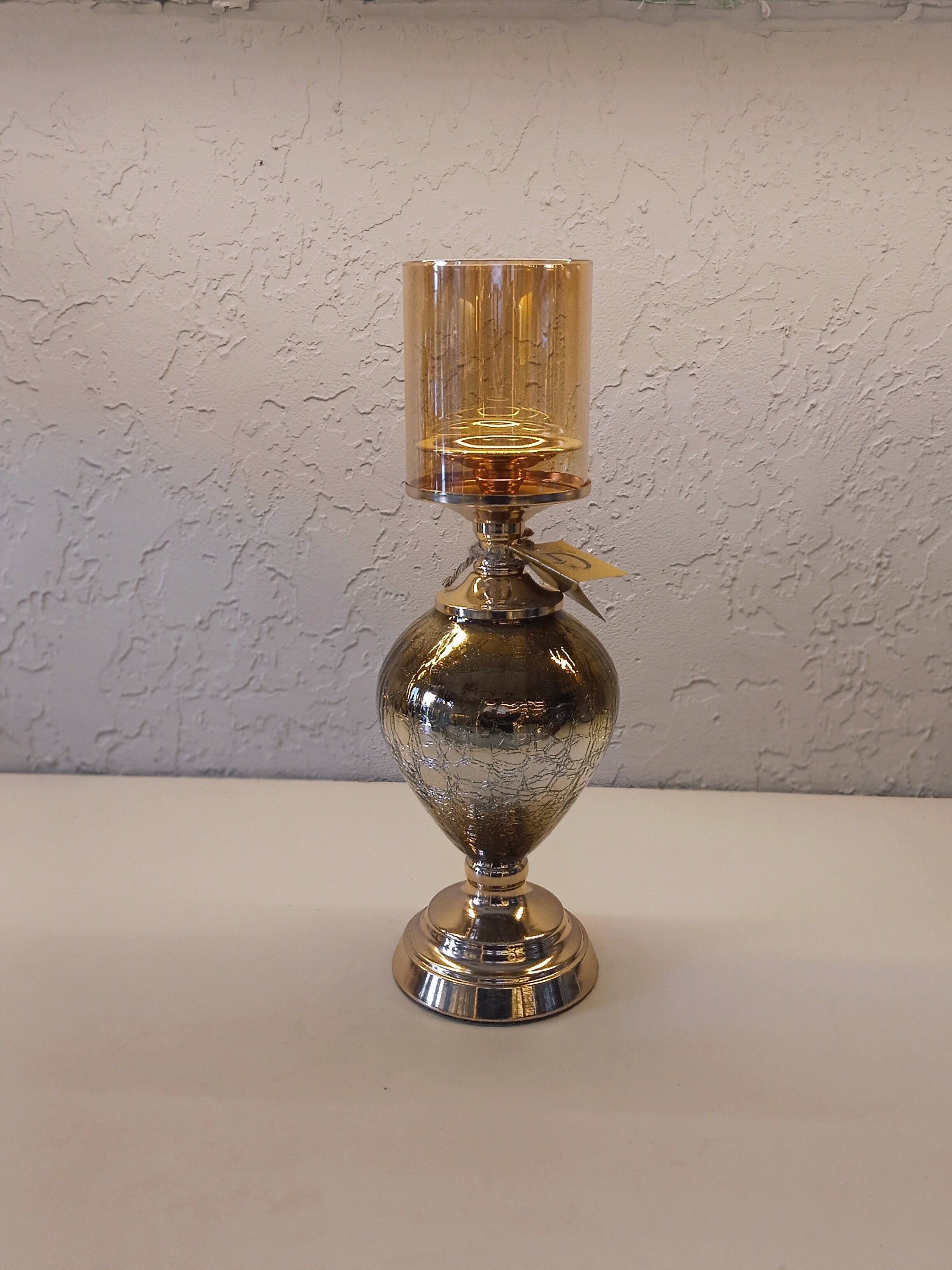 Candle Holders With A Reflective Silver Finish And Amber -Tinted Glass