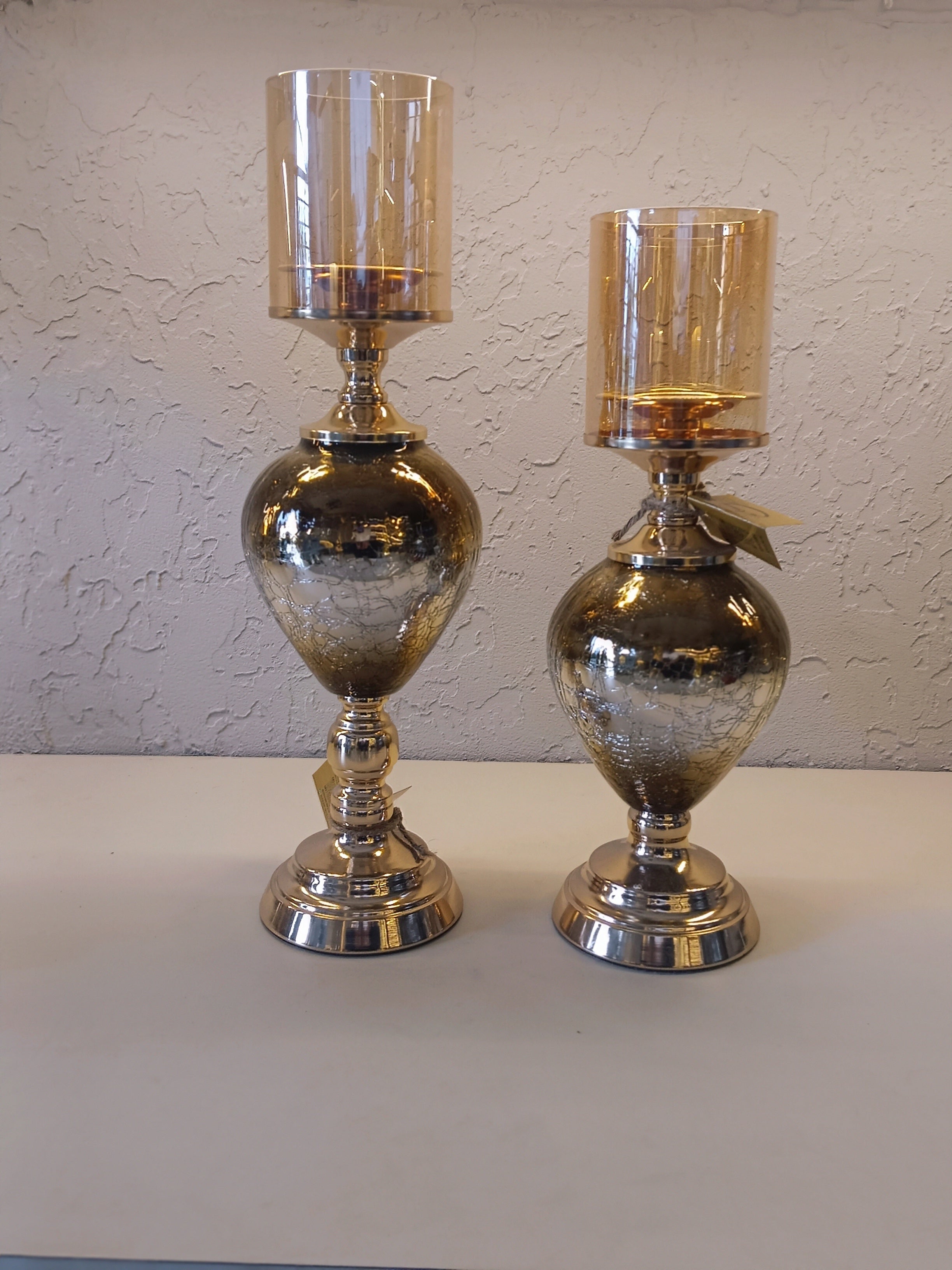 Candle Holders With A Reflective Silver Finish And Amber -Tinted Glass