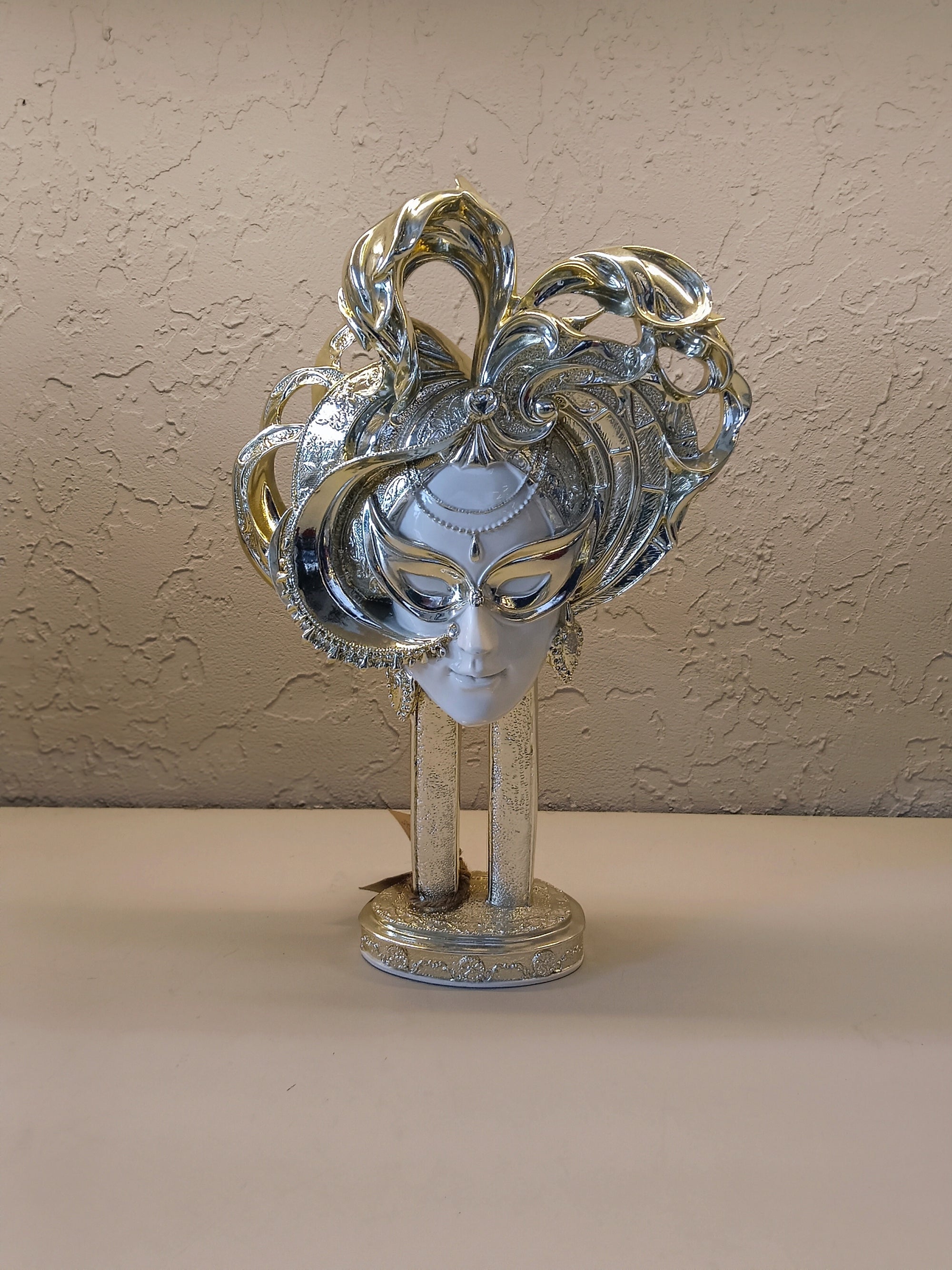 Masked Female Face With A Dazzling Silver Finish
