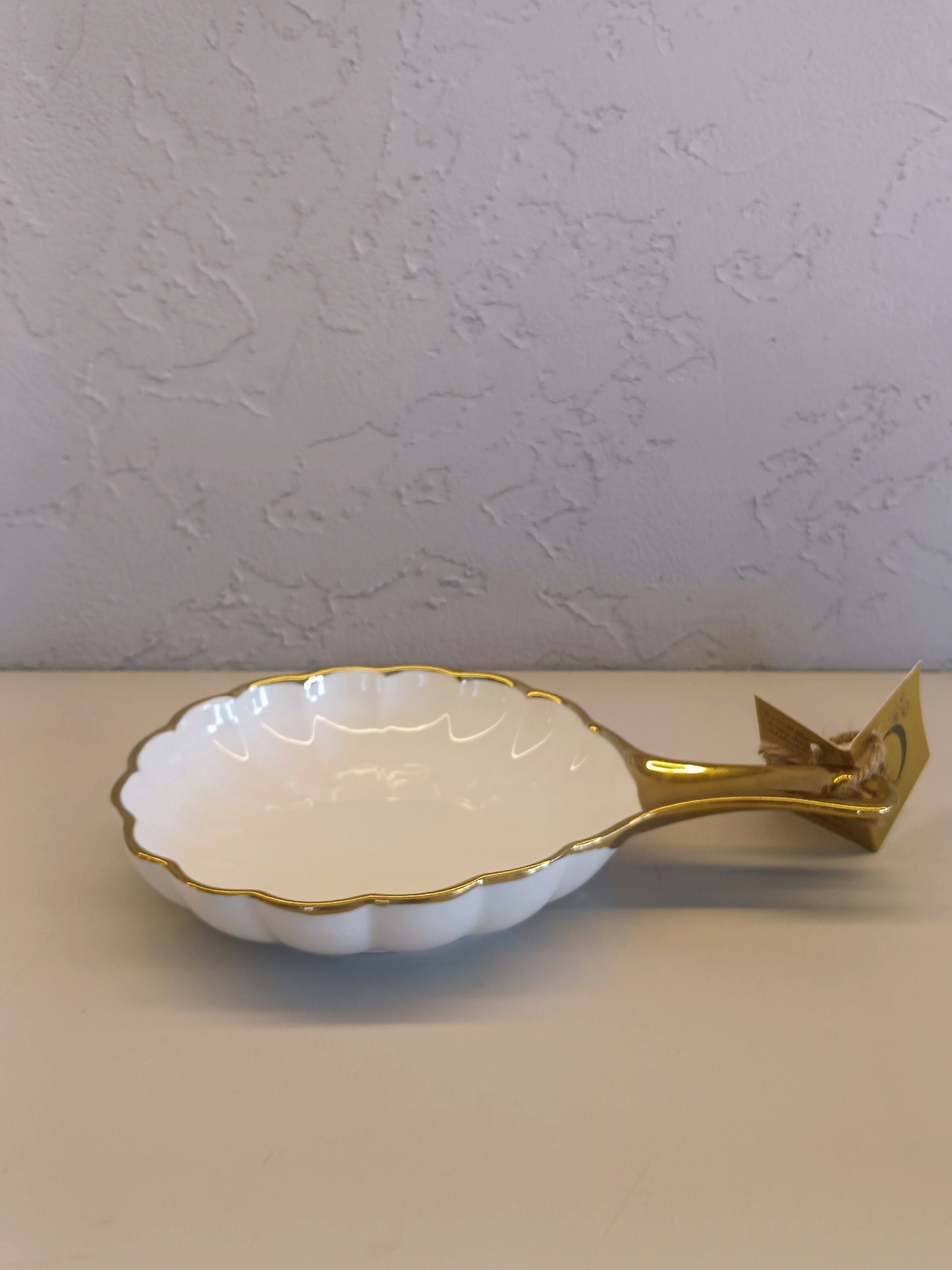White Ceramic Serving Dish With A Scalloped Edge,