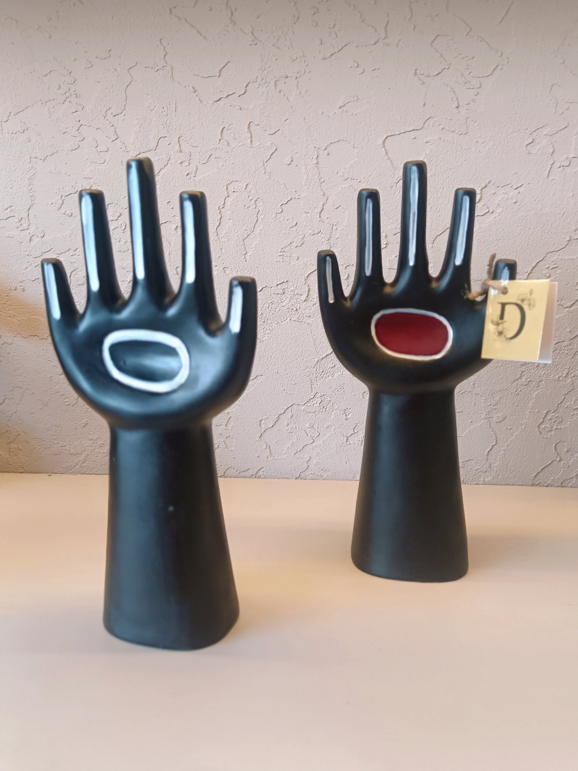 Two Modern, Sculptural Hand-Shaped Objects In A Matte Black Finish