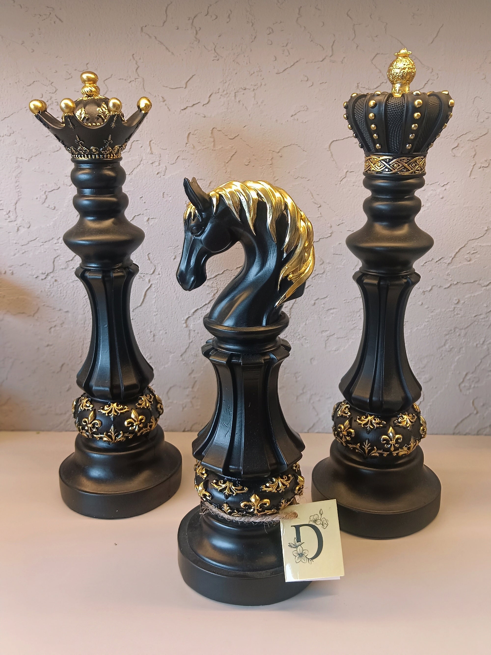 Three Elegantly Styled, Oversized Chess Pieces: A Queen, A Knight, And A King