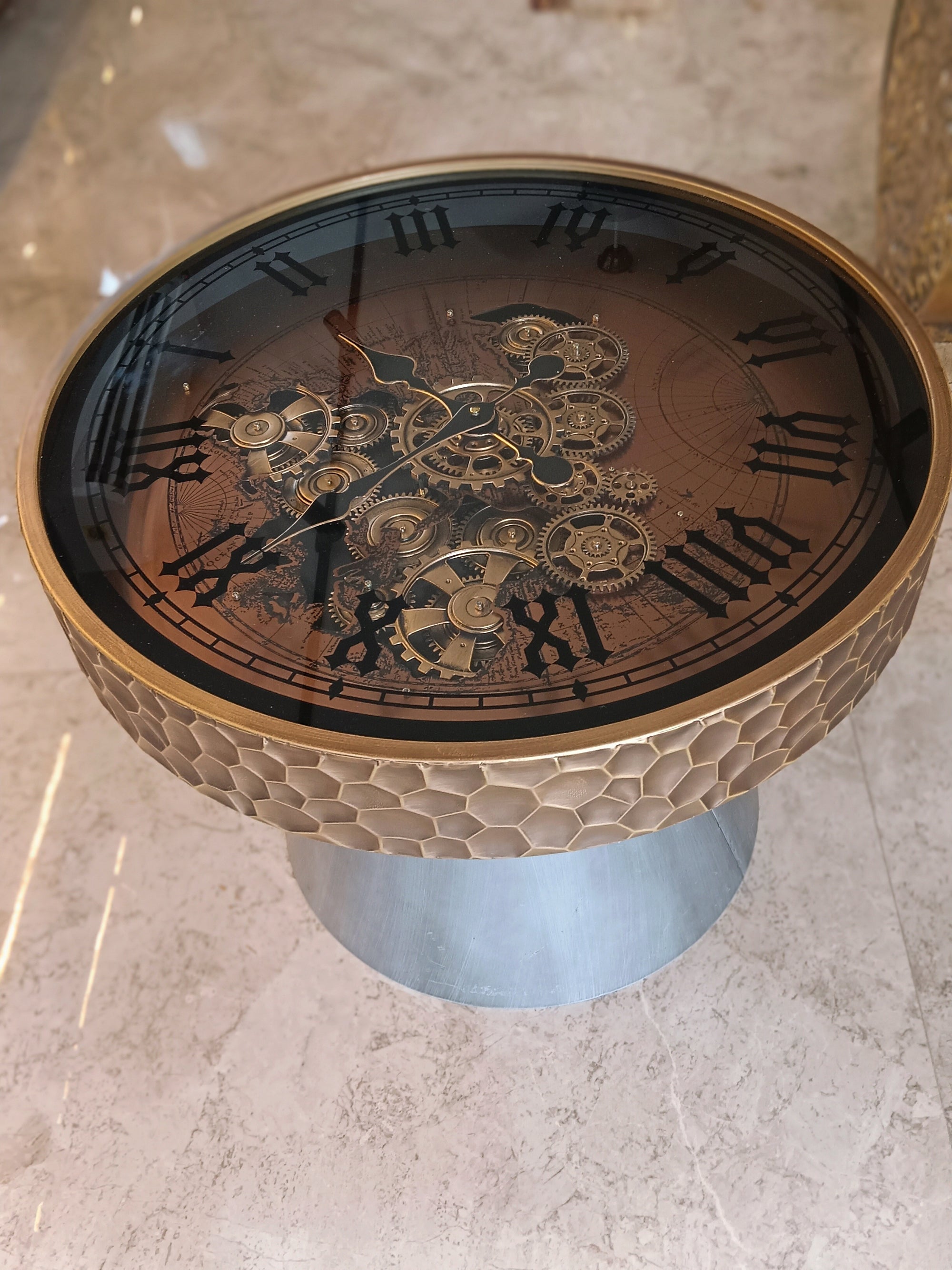 Designer Center Table With A Unique Clock-Themed Glass Top, Featuring Intricate Moving Gear Set On A Metallic Base