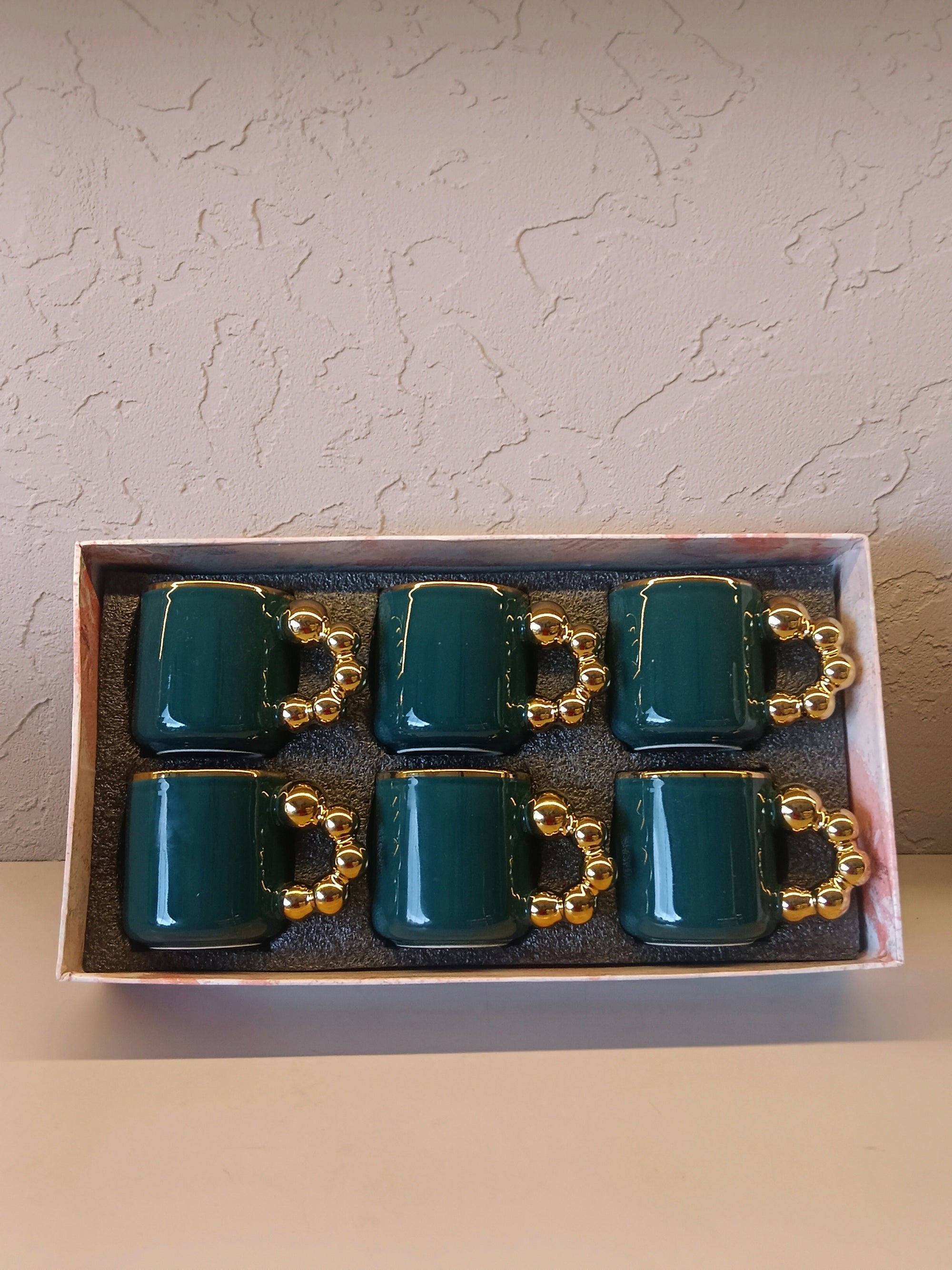 This Is A Stylish Ceramic Mug Featuring A Glossy Teal Body