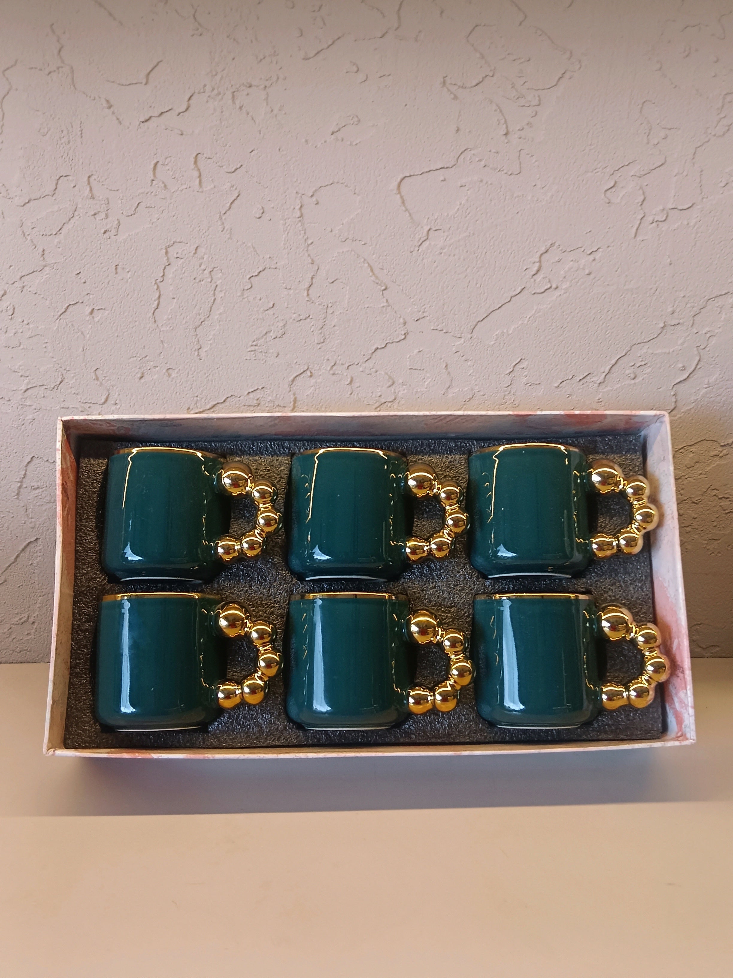 This Is A Stylish Ceramic Mug Featuring A Glossy Teal Body