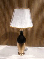 Stylish Modern Table Lamp With A Sleek Black And Gold Metallic Base