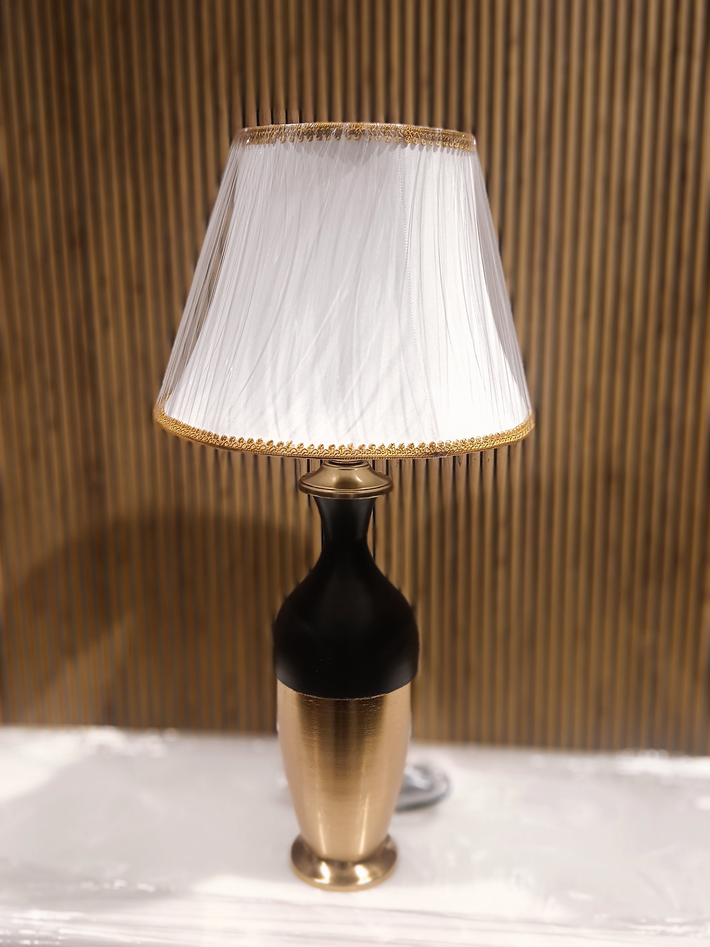 Stylish Modern Table Lamp With A Sleek Black And Gold Metallic Base