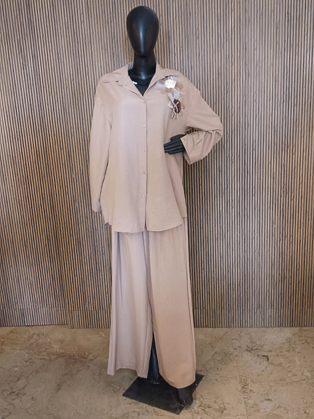 A Stylish Beige Co-ord Set Featuring A Relaxed-fit Shirt With A Collar And Button-Down Front