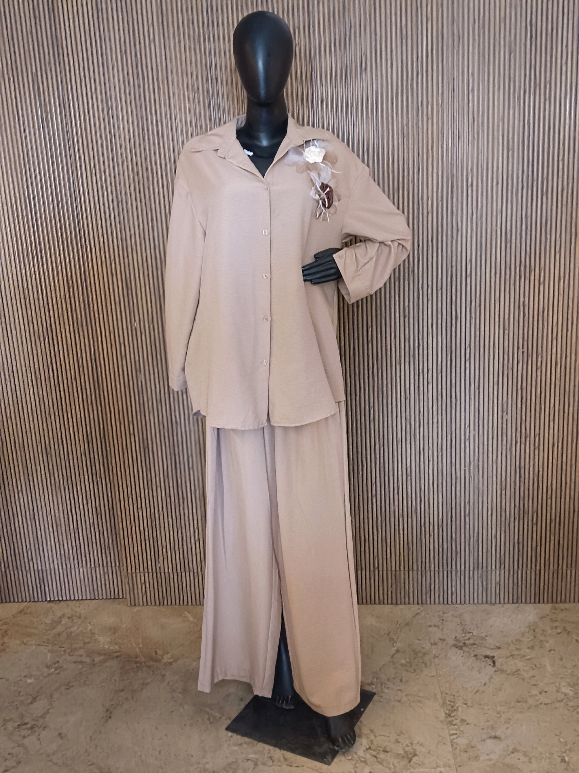 A Stylish Beige Co-ord Set Featuring A Relaxed-fit Shirt With A Collar And Button-Down Front