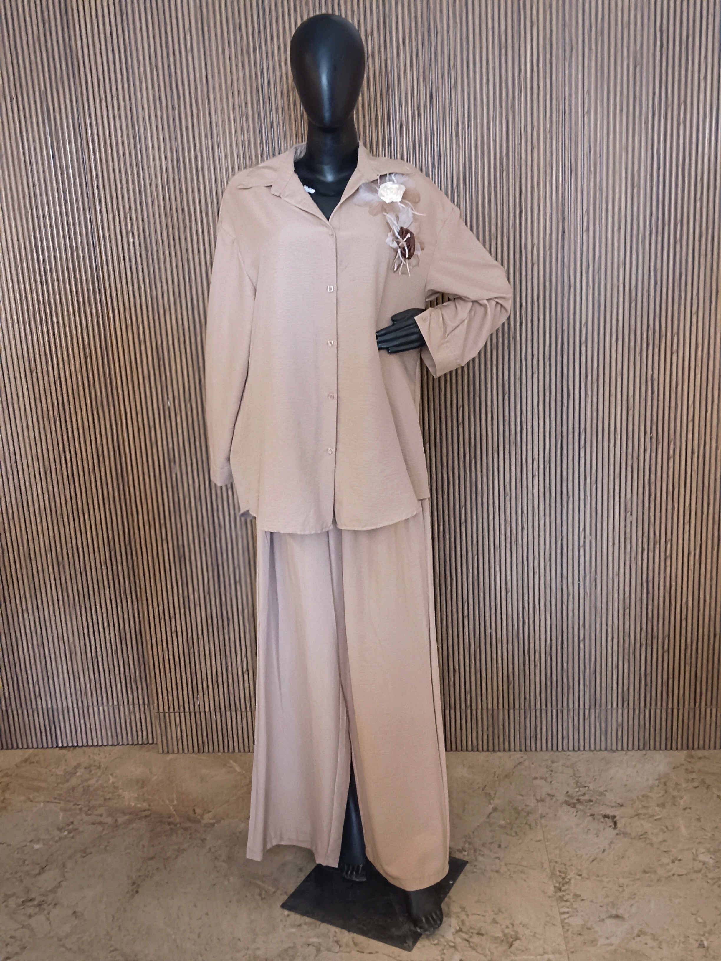 A Stylish Beige Co-ord Set Featuring A Relaxed-fit Shirt With A Collar And Button-Down Front