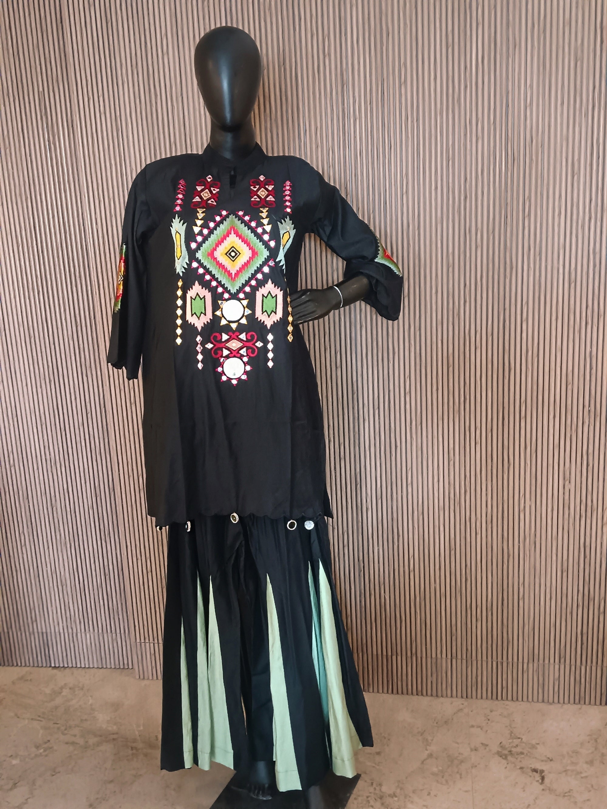 Black Kurti With Bold, Multicolored Geometric Embroidery And Mirror Work On The Yoke And Sleeves