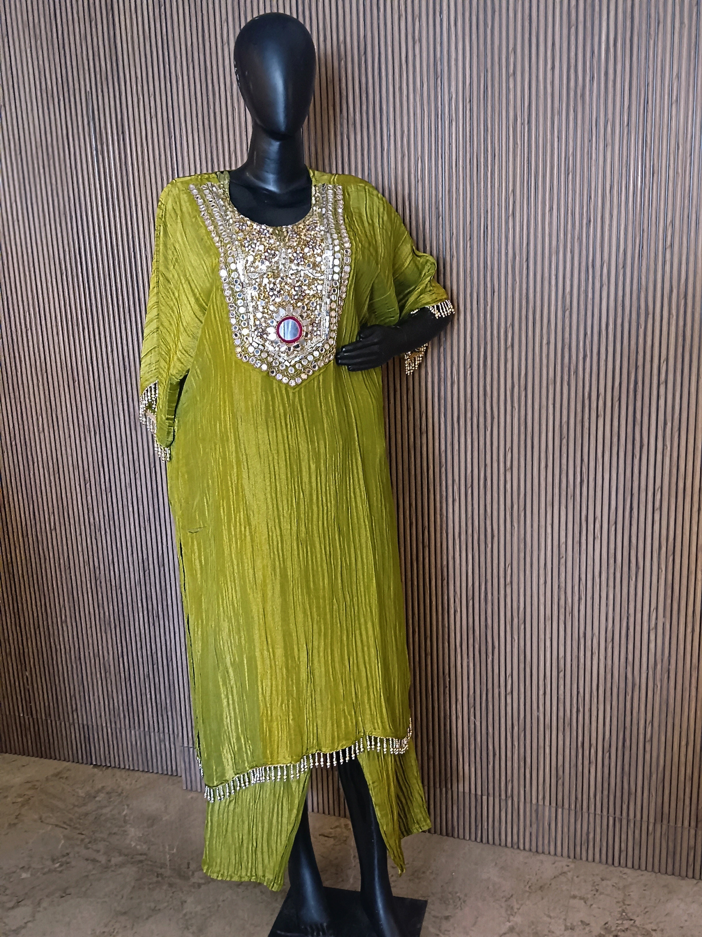 Olive Green Ethnic Kurti Made From Crinkle-Texture Fabric, Featuring Lavish Mirror And Sequin Embroidery On The Yoke