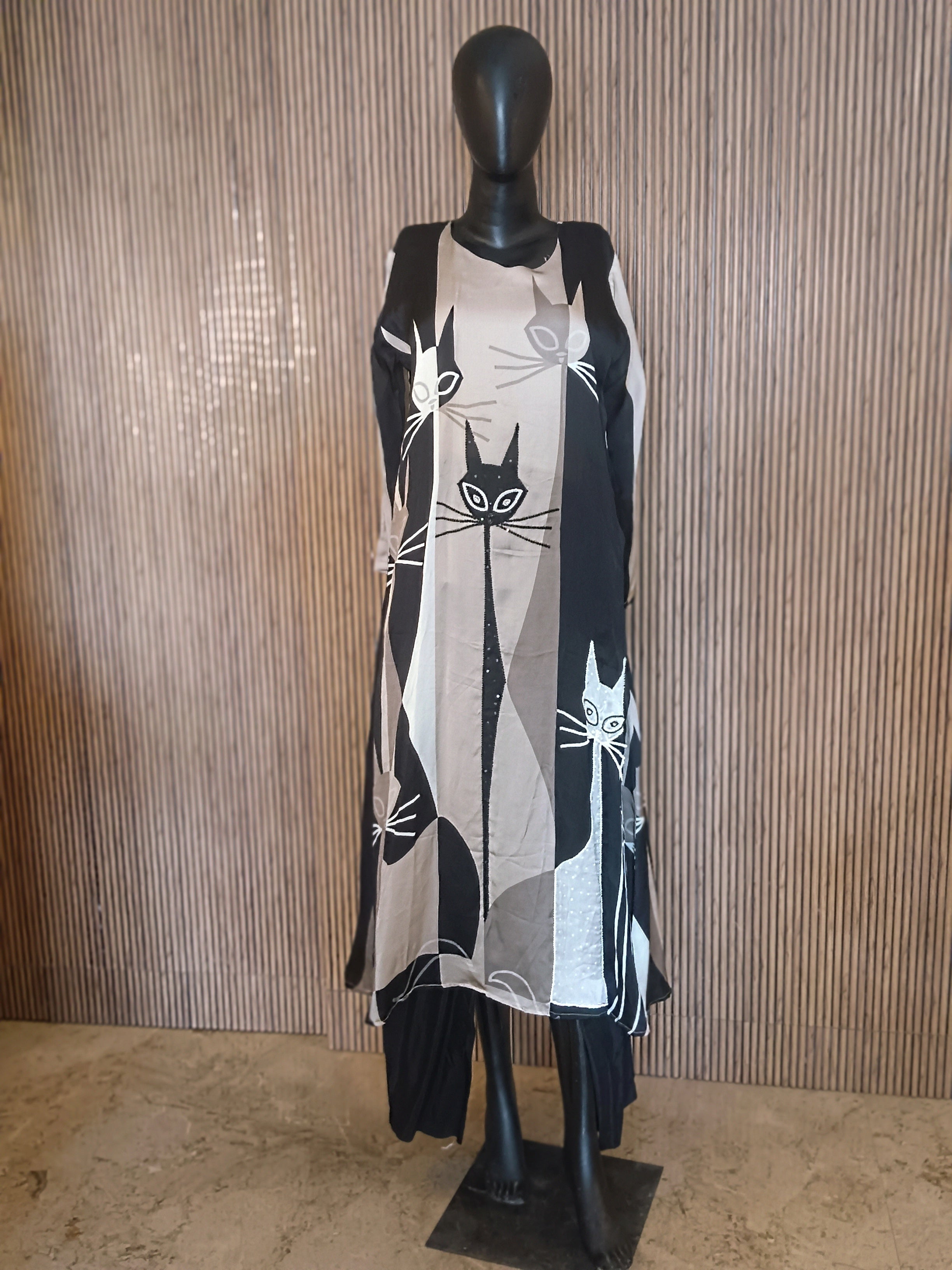 A Stylish, Black-And-Grey Printed Kurti Featuring Striking Abstract Cat Motifs