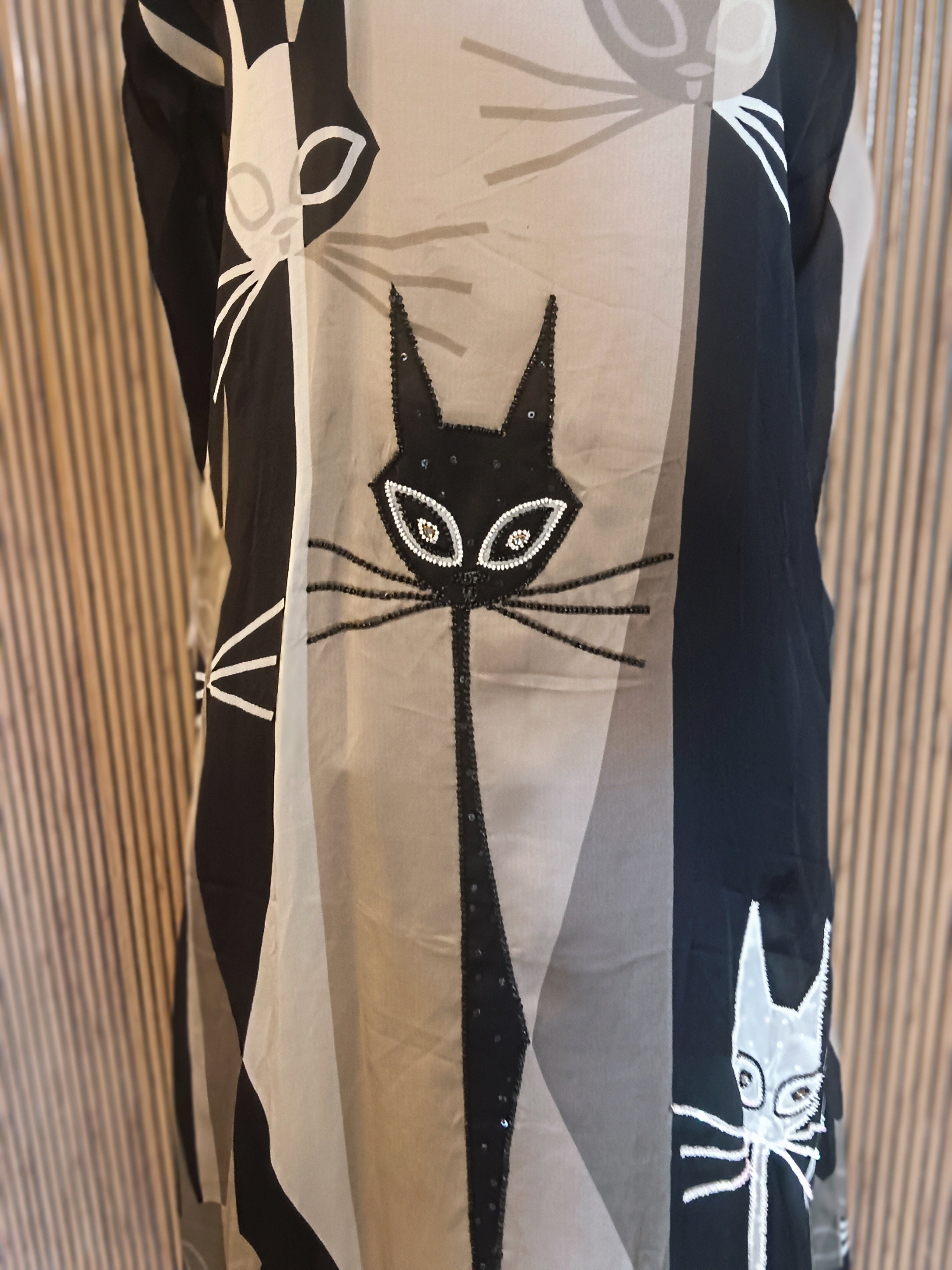 A Stylish, Black-And-Grey Printed Kurti Featuring Striking Abstract Cat Motifs