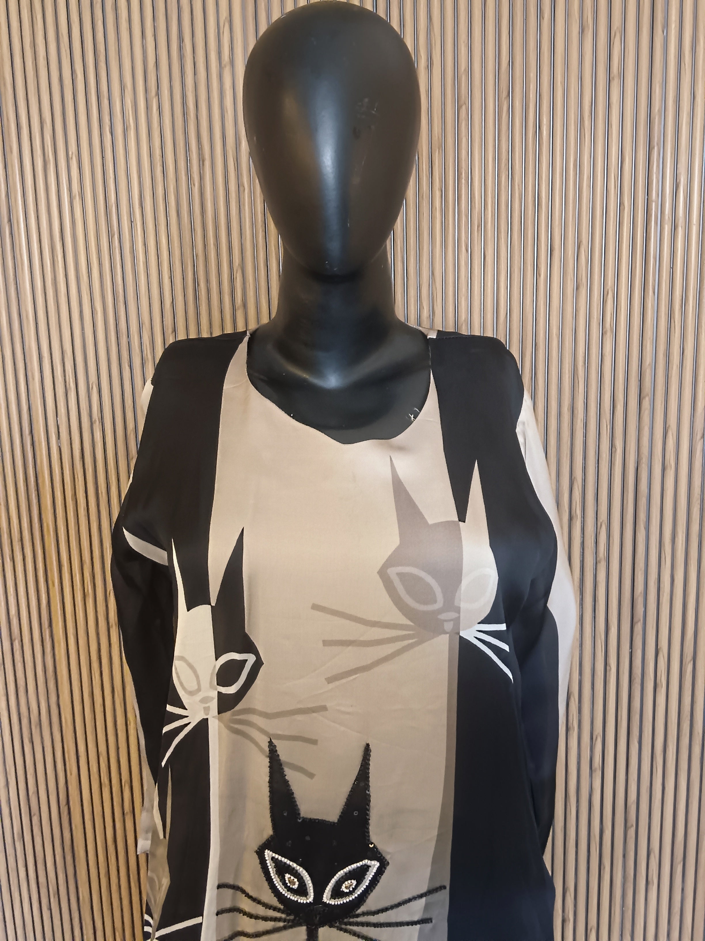 A Stylish, Black-And-Grey Printed Kurti Featuring Striking Abstract Cat Motifs