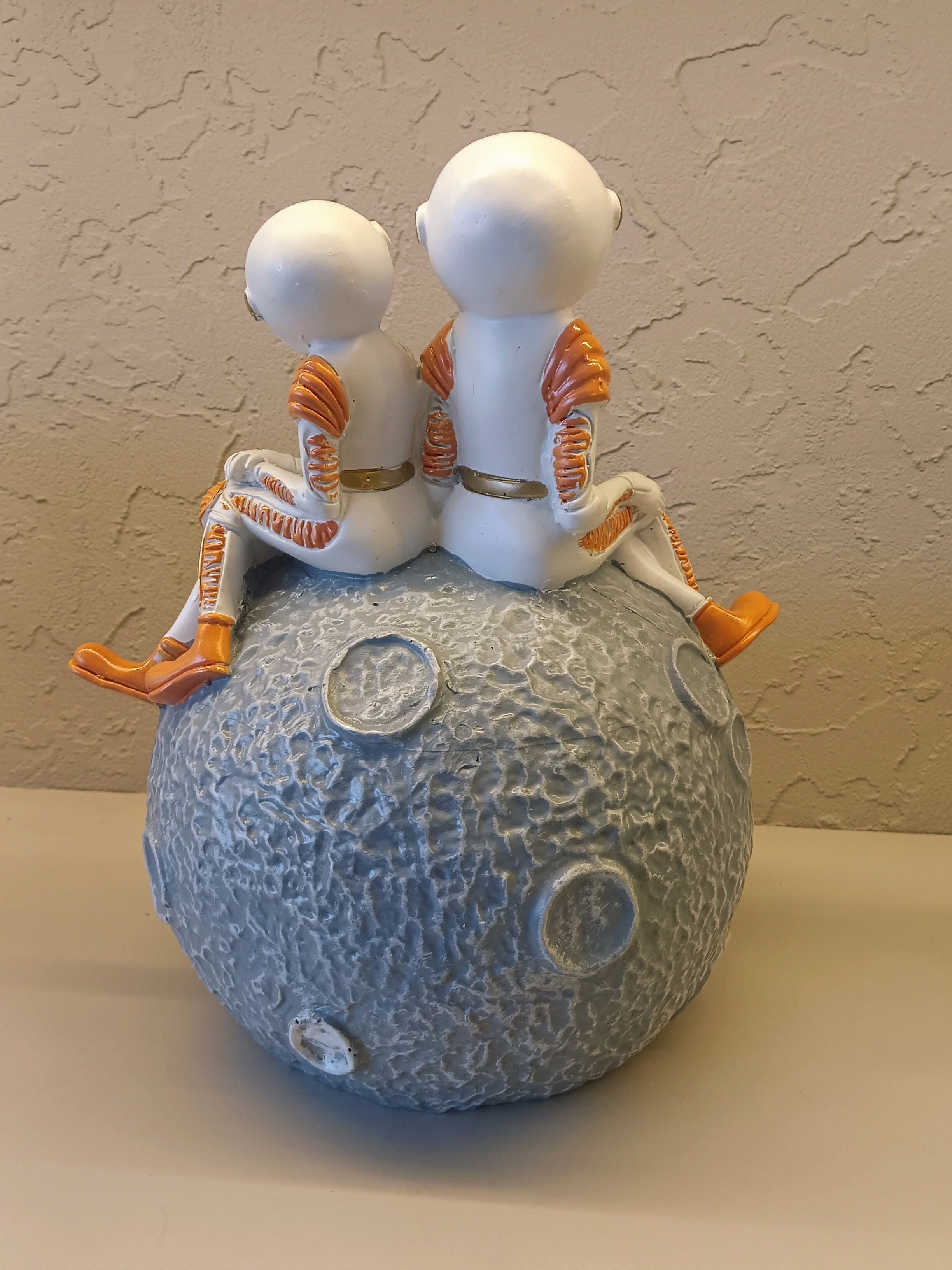 Decorative Figurine Featuring Two Astronauts In White Suits With Golden Visors