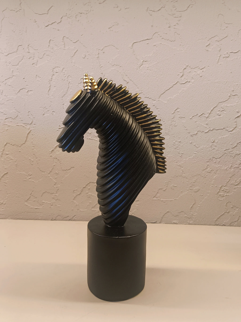 A Contemporary Abstract Horse Head Sculpture In Matte Black With Ribbed Detailing