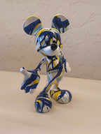 A Vibrant Artistic Figurine Of Mickey Mouse, Designed With An Abstract Splash Pattern