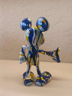 A Vibrant Artistic Figurine Of Mickey Mouse, Designed With An Abstract Splash Pattern