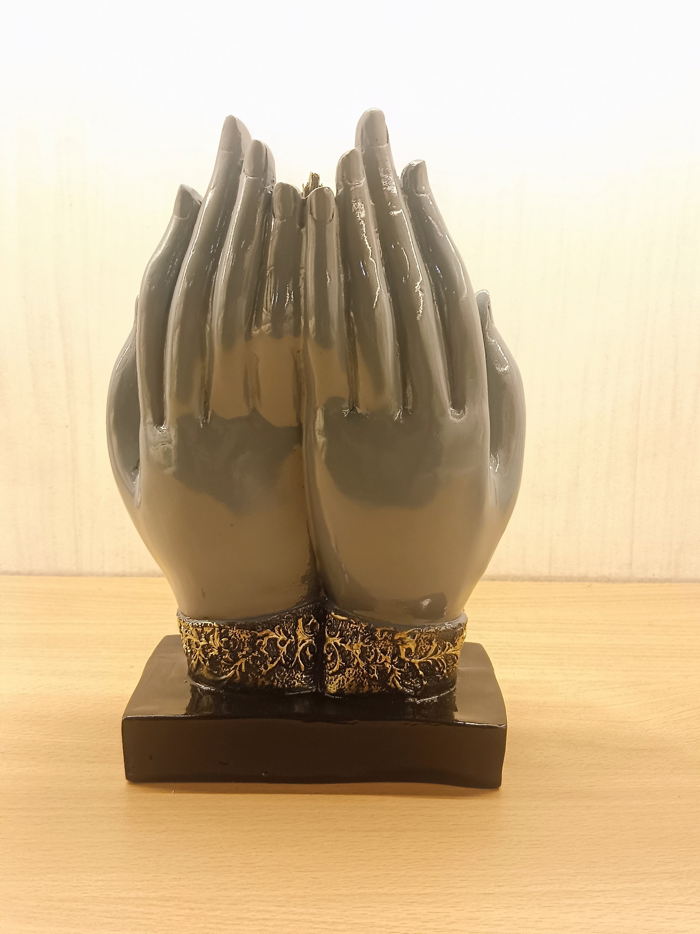 This Elegant Buddha Head Statue Is Designed Within Protective Hands, Symbolizing Peace, Divine Blessings