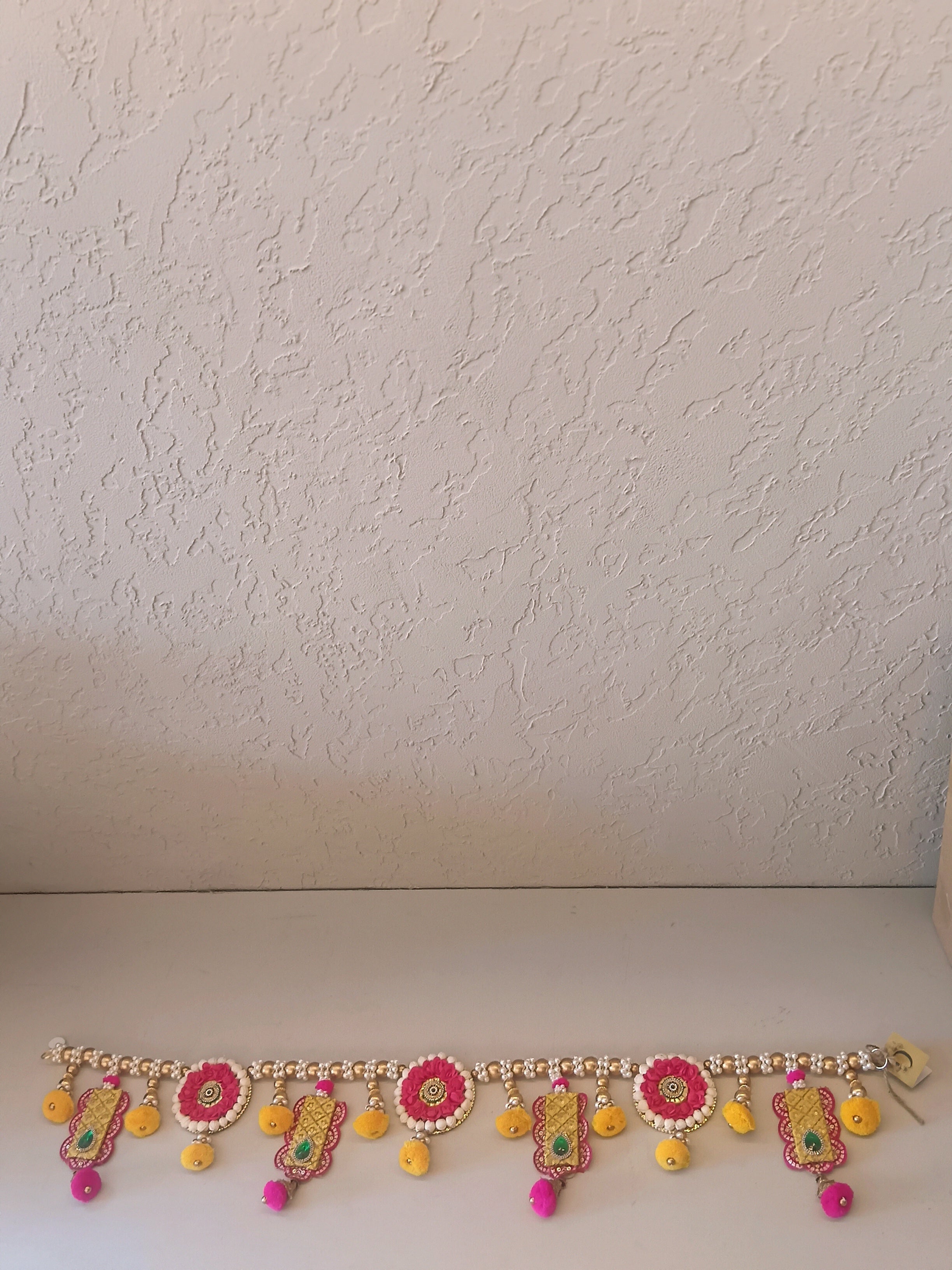 Vibrant Decorative Bandhanwar Is Crafted With Colorful Beads, Pom-Poms, And Traditional Motifs