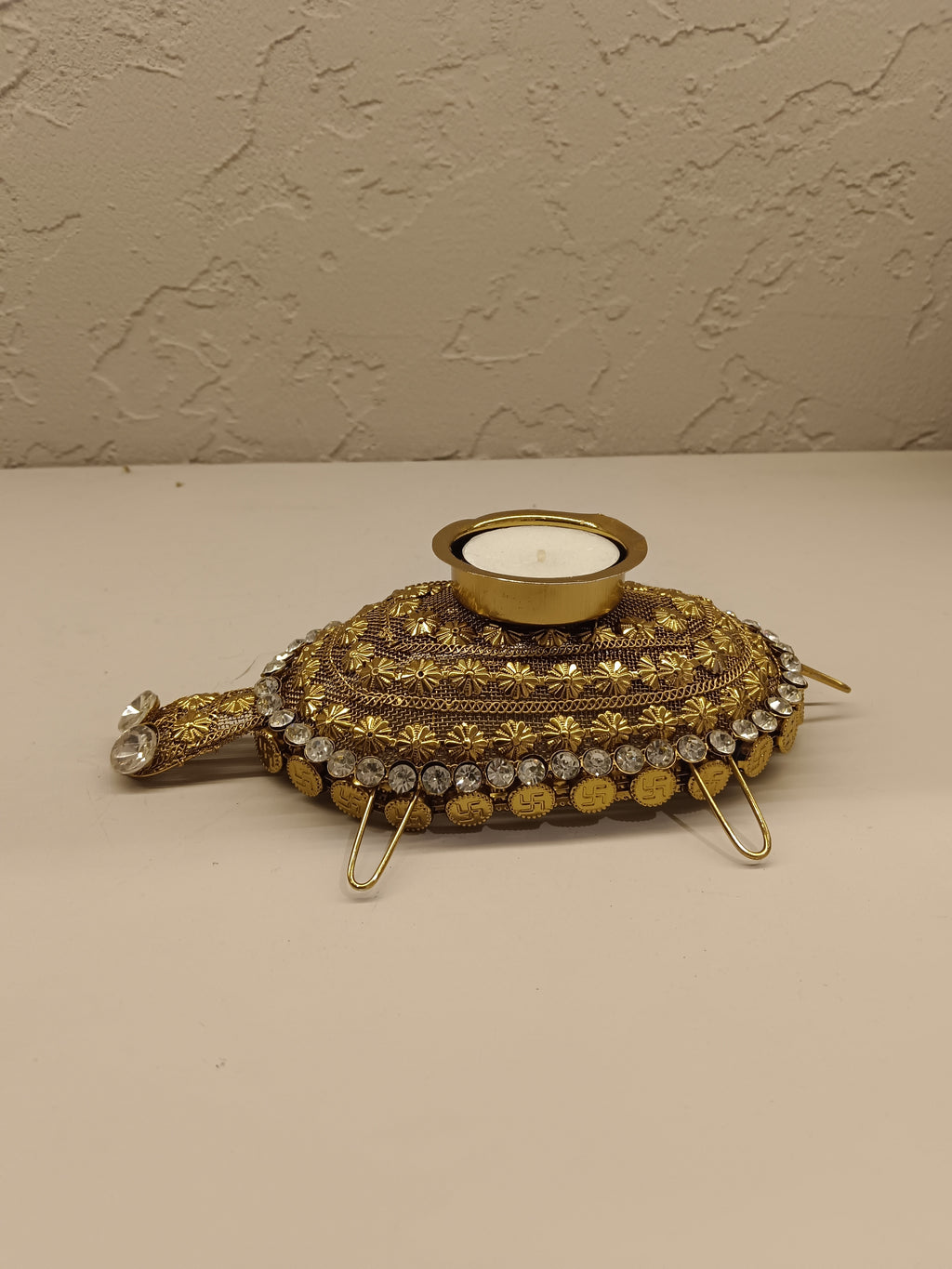 Beautifully crafted turtle-shaped tealight holder adorned with intricate golden detailing
