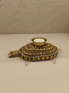 Beautifully crafted turtle-shaped tealight holder adorned with intricate golden detailing