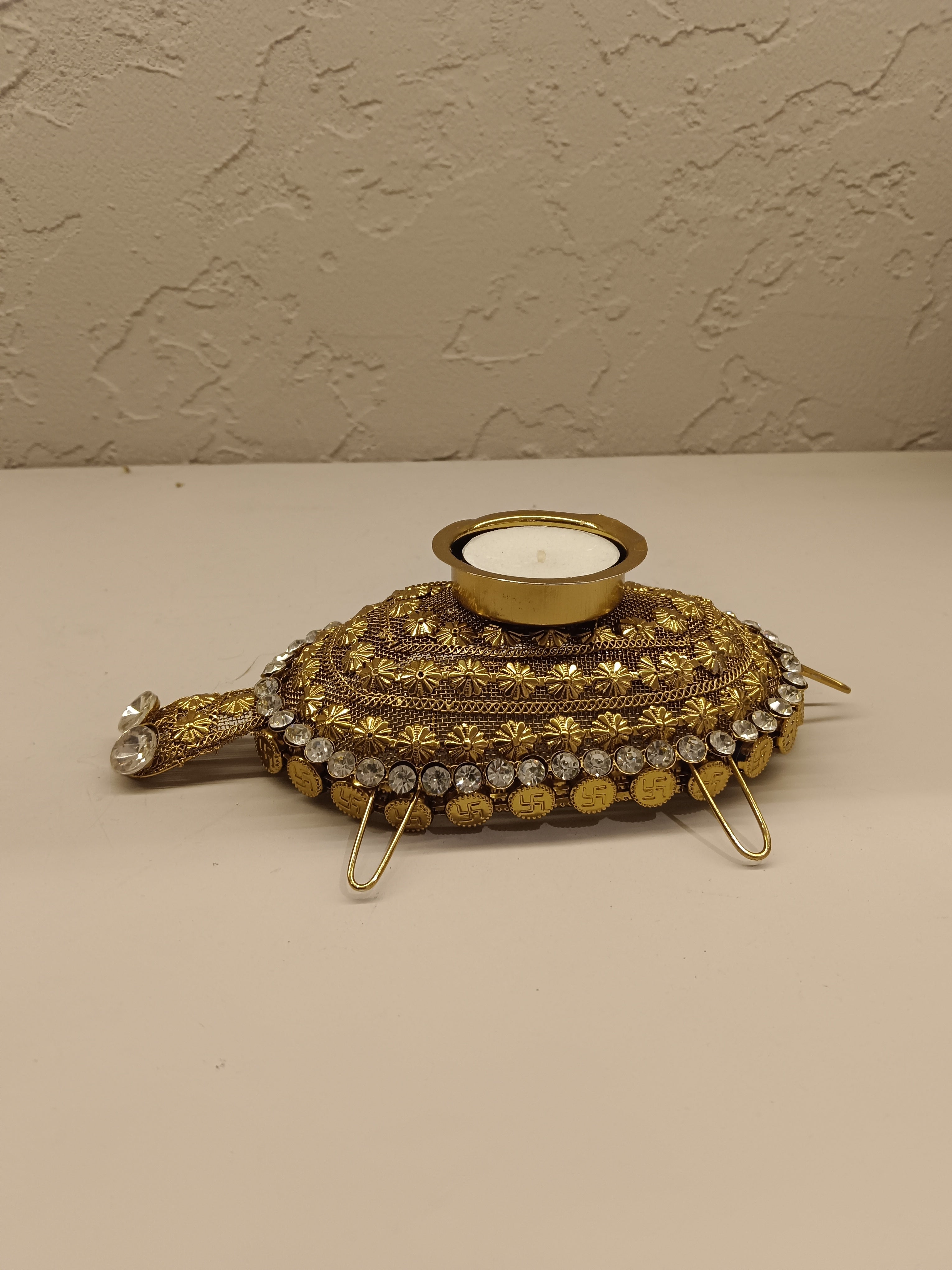 Beautifully crafted turtle-shaped tealight holder adorned with intricate golden detailing