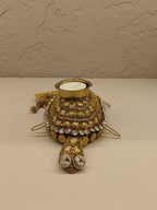 Beautifully crafted turtle-shaped tealight holder adorned with intricate golden detailing