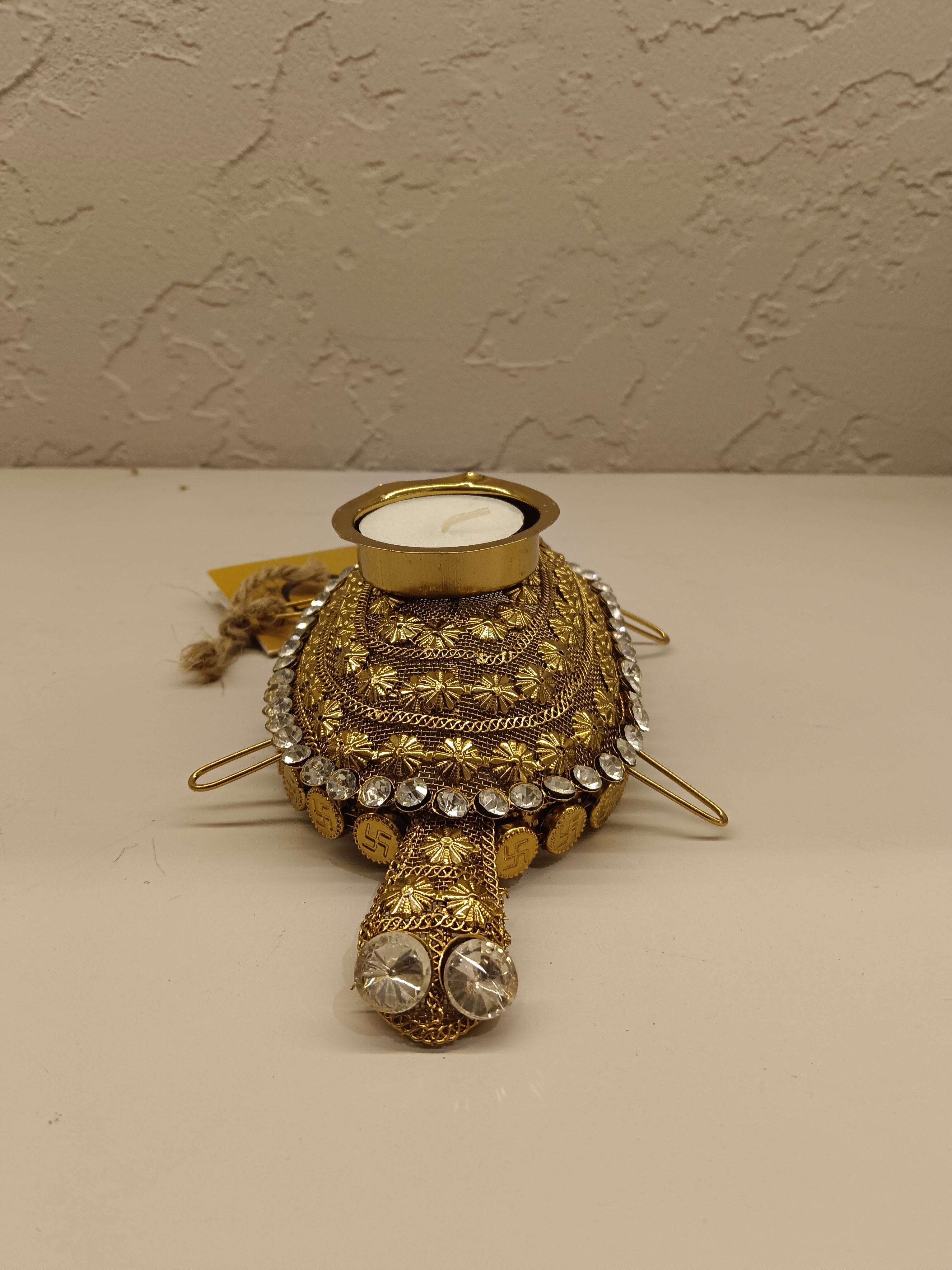 Beautifully crafted turtle-shaped tealight holder adorned with intricate golden detailing