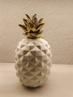 Stylish ceramic pineapple décor pieces with a modern geometric design and glossy finish.