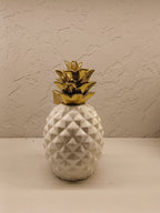 Stylish ceramic pineapple décor pieces with a modern geometric design and glossy finish.