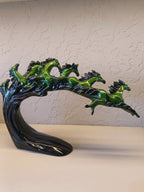 Dynamic and artistic sculpture of running horses, designed with a glossy green and black