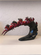 Dynamic and artistic sculpture of running horses, designed with a glossy maroon and black