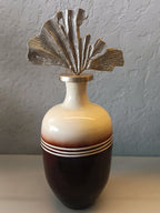 A PAIR OF ELEGANT DECORATIVE METAL VASES FEATURING A GLOSSY TWO-TONE FINISH